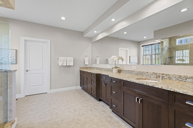 20 Peach Ln, East Lyme, CT 06333 - full bathroom with a tile shower, double vanity, recessed lighting, baseboards, and tile patterned flooring