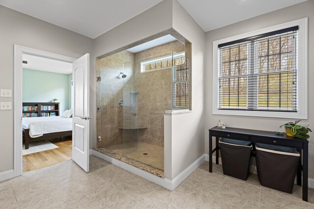 20 Peach Ln, East Lyme, CT 06333 - bathroom featuring a tile shower, baseboards, ensuite bathroom, and tile patterned flooring