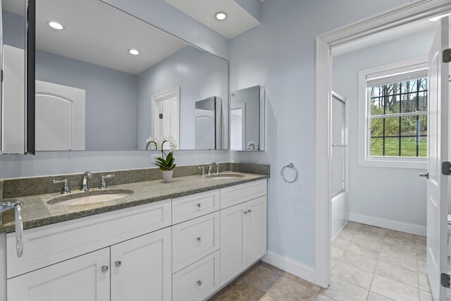 20 Peach Ln, East Lyme, CT 06333 - full bath featuring double vanity, baseboards, bath / shower combo with glass door, and recessed lighting