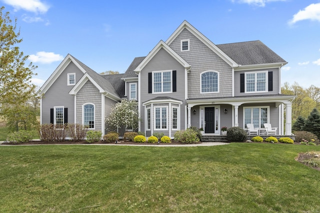 20 Peach Ln, East Lyme, CT 06333 - view of front of property featuring a front yard and a porch