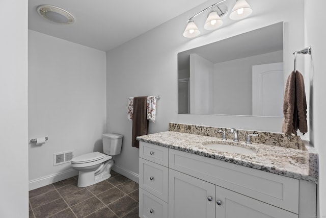 20 Peach Ln, East Lyme, CT 06333 - bathroom with baseboards, vanity, toilet, and tile patterned floors