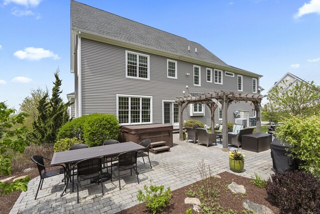 20 Peach Ln, East Lyme, CT 06333 - back of property featuring a hot tub, a pergola, a patio, outdoor dining area, and an outdoor living space
