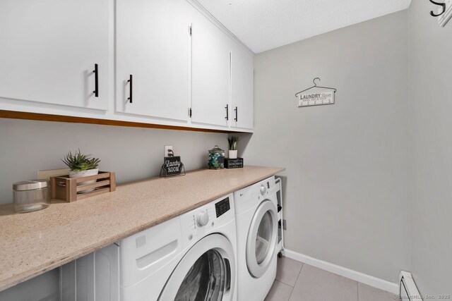 laundry area with light tile patterned floors, separate washer and dryer, cabinet space, baseboards, and a baseboard heating unit