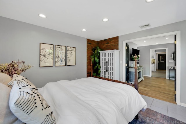 bedroom with visible vents, baseboards, light tile patterned floors, and recessed lighting