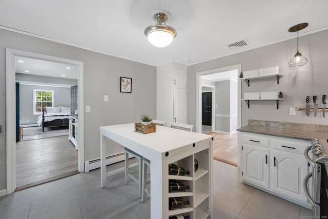 kitchen featuring white cabinetry, open shelves, visible vents, and stainless steel range