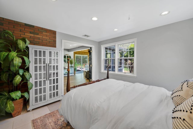bedroom with tile patterned floors, recessed lighting, and visible vents