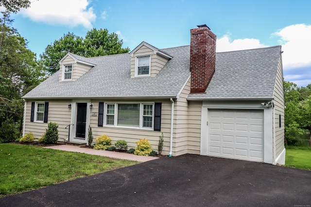 17 Alan Ave, Danbury, CT 06811 - cape cod-style house with an attached garage, roof with shingles, asphalt driveway, a chimney, and a front lawn