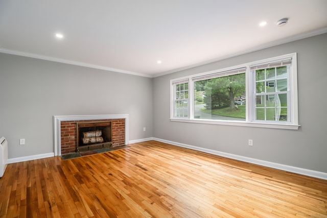 17 Alan Ave, Danbury, CT 06811 - unfurnished living room featuring crown molding, hardwood / wood-style flooring, baseboards, a fireplace, and recessed lighting