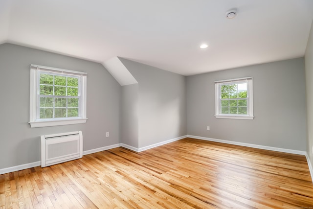 17 Alan Ave, Danbury, CT 06811 - additional living space with light wood-style flooring, vaulted ceiling, baseboards, recessed lighting, and heating unit