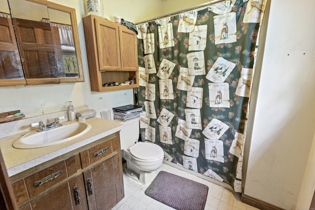 full bath featuring toilet, tile patterned floors, vanity, and curtained shower