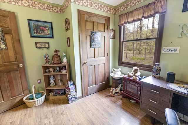 foyer entrance with wood finished floors