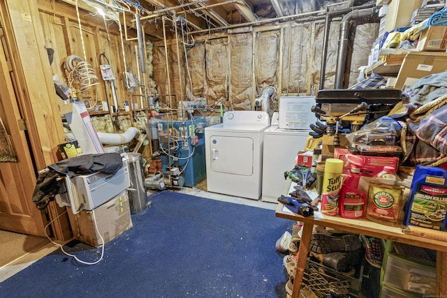 unfinished basement featuring washer and dryer and a heating unit