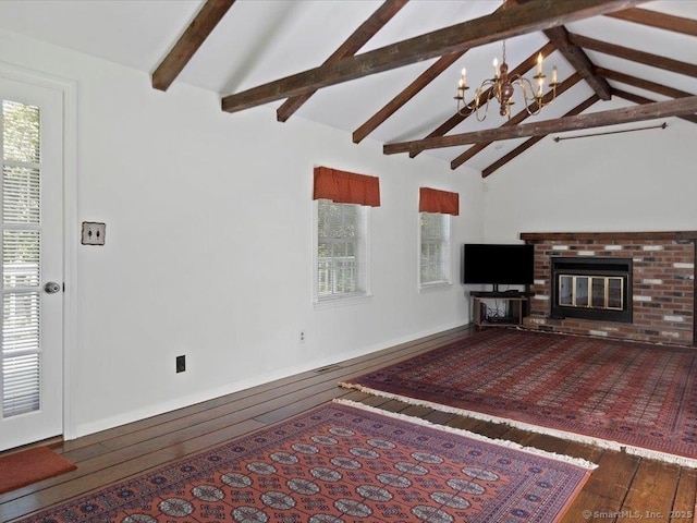 23 Pine Woods Rd, North Stonington, CT 06359 - living room with hardwood / wood-style floors, a chandelier, plenty of natural light, and a brick fireplace
