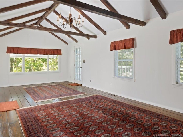 23 Pine Woods Rd, North Stonington, CT 06359 - unfurnished living room featuring wood-type flooring, plenty of natural light, and a chandelier