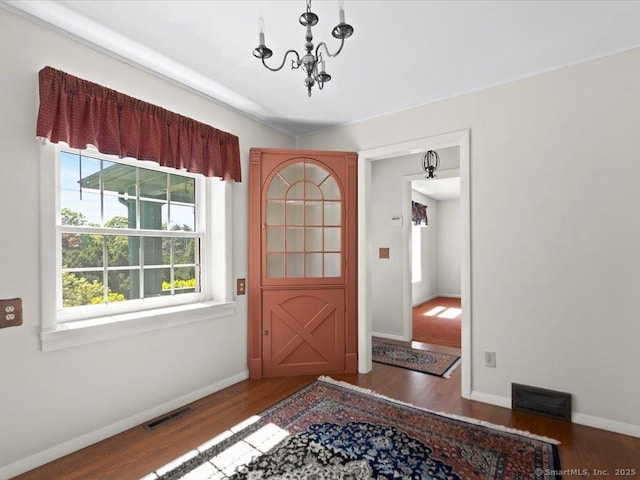 23 Pine Woods Rd, North Stonington, CT 06359 - foyer featuring wood finished floors and a chandelier