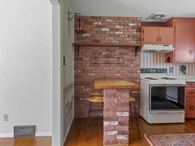 23 Pine Woods Rd, North Stonington, CT 06359 - kitchen featuring white electric stove, under cabinet range hood, wood finished floors, and light countertops