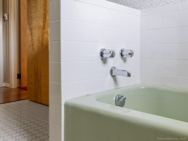 23 Pine Woods Rd, North Stonington, CT 06359 - bathroom featuring tile patterned flooring and bathing tub / shower combination