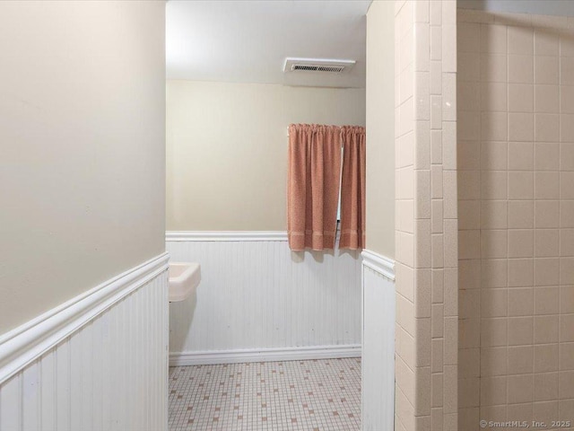23 Pine Woods Rd, North Stonington, CT 06359 - full bathroom with wainscoting and tile patterned flooring