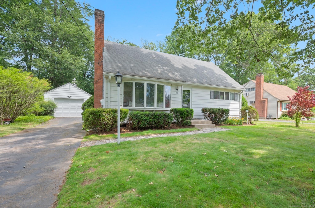 26 John Smith Dr, West Hartford, CT 06107 - view of front of house with an outbuilding, a garage, a front yard, and a chimney