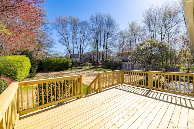 8 Tyrell Dr, Wolcott, CT 06716 - wooden terrace featuring a storage unit, an outdoor structure, and fence