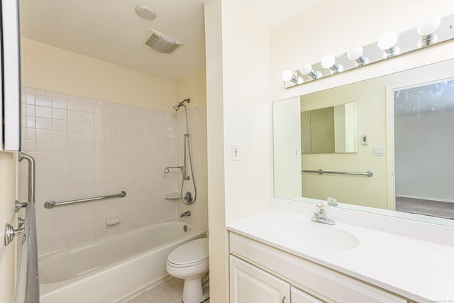 bathroom with toilet,  shower combination, vanity, and tile patterned flooring