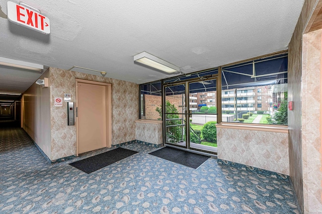 common area with a textured ceiling