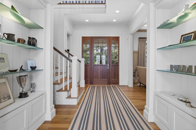 250 Joshua Point Rd, Guilford, CT 06437 - foyer with light wood finished floors, crown molding, stairway, and recessed lighting
