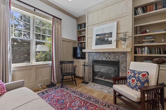 250 Joshua Point Rd, Guilford, CT 06437 - sitting room featuring built in features, a fireplace, and light wood-style flooring