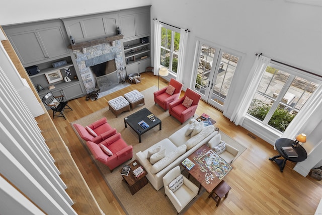 250 Joshua Point Rd, Guilford, CT 06437 - living area with light wood-style flooring and a fireplace