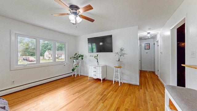 86 Butler Ave, Southington, CT 06489 - living area with a baseboard heating unit, light wood-style flooring, ceiling fan, and baseboards
