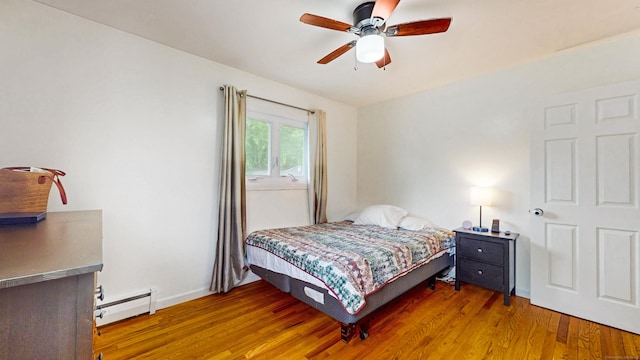 86 Butler Ave, Southington, CT 06489 - bedroom with baseboard heating, wood finished floors, a ceiling fan, and baseboards