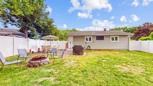 86 Butler Ave, Southington, CT 06489 - back of property featuring a fire pit, a chimney, and a patio area