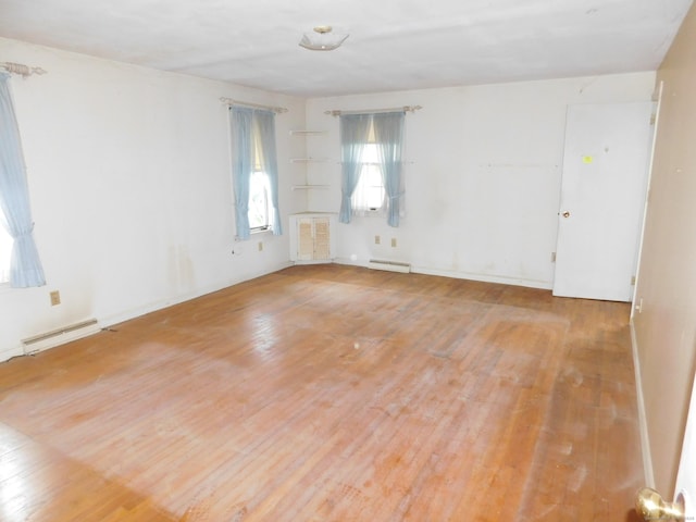 42 Riverside Dr, Branford, CT 06405 - unfurnished room featuring wood finished floors and a baseboard heating unit