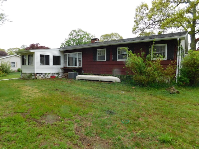 42 Riverside Dr, Branford, CT 06405 - back of property featuring a chimney and a yard