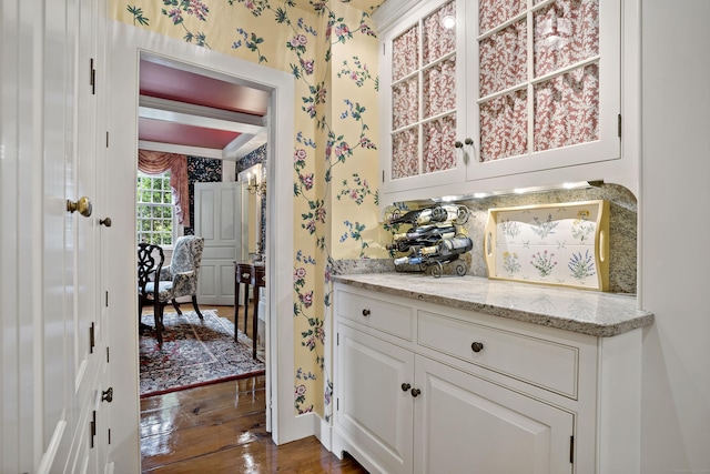 173 Highwoods Dr, Guilford, CT 06437 - kitchen featuring wallpapered walls, white cabinetry, dark wood-style floors, light stone counters, and baseboards