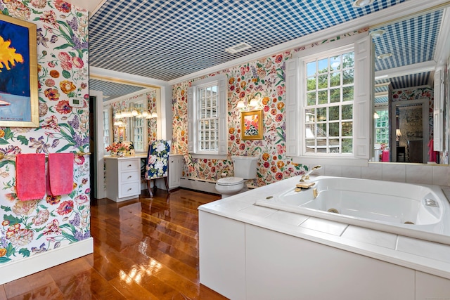 173 Highwoods Dr, Guilford, CT 06437 - bathroom featuring wallpapered walls, a baseboard heating unit, crown molding, a jetted tub, and wood-type flooring
