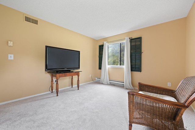 living area featuring carpet, baseboards, and baseboard heating