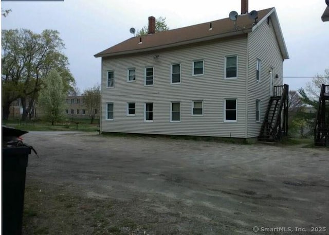 8-12 High St, Putnam, CT 06260 - rear view of house featuring stairway and a chimney