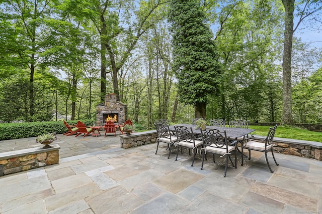41 Little Brook Rd, Wilton, CT 06897 - view of patio featuring outdoor dining area and an outdoor stone fireplace