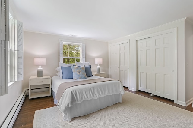 41 Little Brook Rd, Wilton, CT 06897 - bedroom featuring baseboard heating, ornamental molding, two closets, and dark wood-type flooring