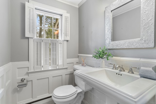 41 Little Brook Rd, Wilton, CT 06897 - half bath with wainscoting, a decorative wall, toilet, and ornamental molding