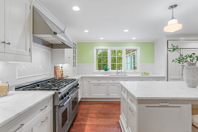 41 Little Brook Rd, Wilton, CT 06897 - kitchen with double oven range, a sink, range hood, white cabinetry, and ornamental molding
