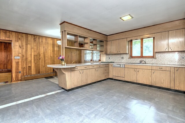 23 Pinesbridge Rd, Oxford, CT 06478 - kitchen featuring light floors, a peninsula, backsplash, a sink, and wooden walls