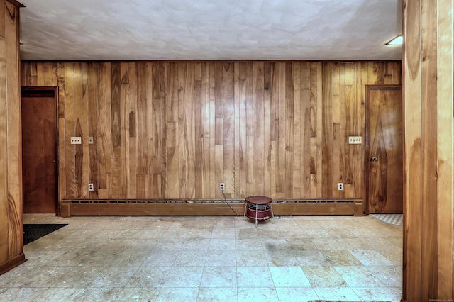 23 Pinesbridge Rd, Oxford, CT 06478 - unfurnished room featuring wooden walls, tile patterned floors, and a baseboard radiator
