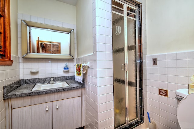 23 Pinesbridge Rd, Oxford, CT 06478 - full bathroom featuring tile walls, a shower stall, toilet, vanity, and wainscoting