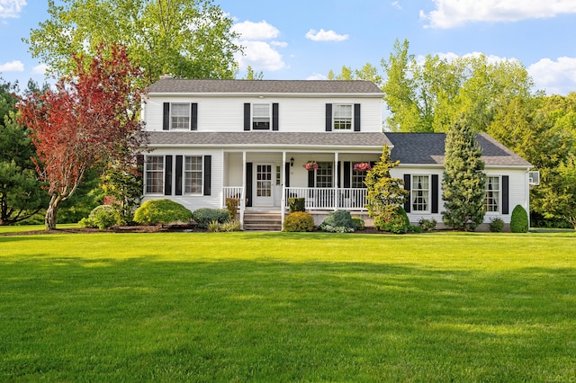 view of front of property featuring a porch and a front yard