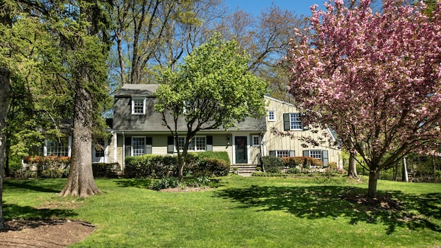 view of front of home featuring a front yard and board and batten siding