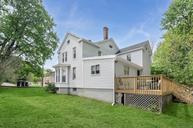 35 S St, Bethel, CT 06801 - rear view of house featuring a yard, a wooden deck, and a chimney