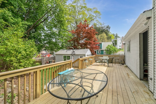 35 S St, Bethel, CT 06801 - deck with outdoor dining space, an outbuilding, a residential view, and fence