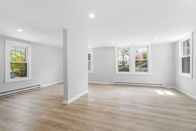 35 S St, Bethel, CT 06801 - unfurnished living room with baseboard heating, recessed lighting, light wood-style flooring, and baseboards